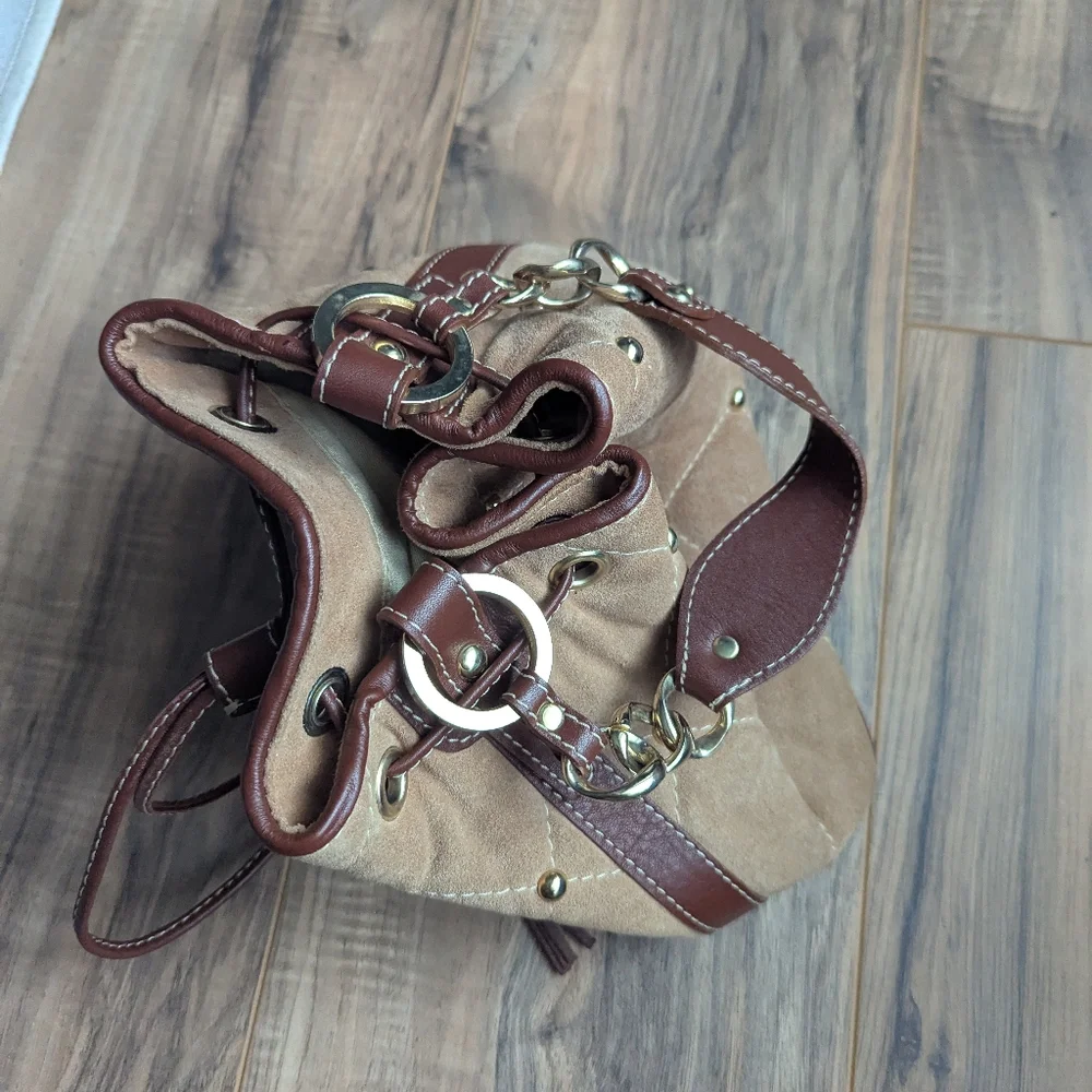 Claudia Firenze Leather Bucket Bag With Pull Top And Tassels.